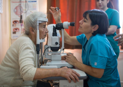 Ophthalmologist surgeon Dr. Mireille Hamparian examines a patitent from Hadrut, Artsakh prior to starting surgery.