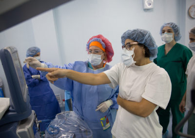 Dr. Mireille Hamparian and surgery technician Angel Matevossian working on the phaco tower moments before surgery.